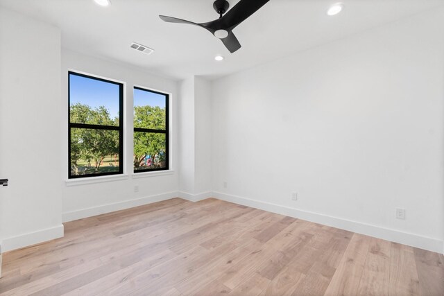 unfurnished room featuring ceiling fan and light wood-type flooring