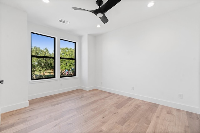 unfurnished room with ceiling fan and light hardwood / wood-style floors