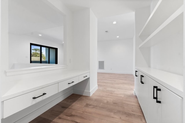 corridor featuring light hardwood / wood-style flooring