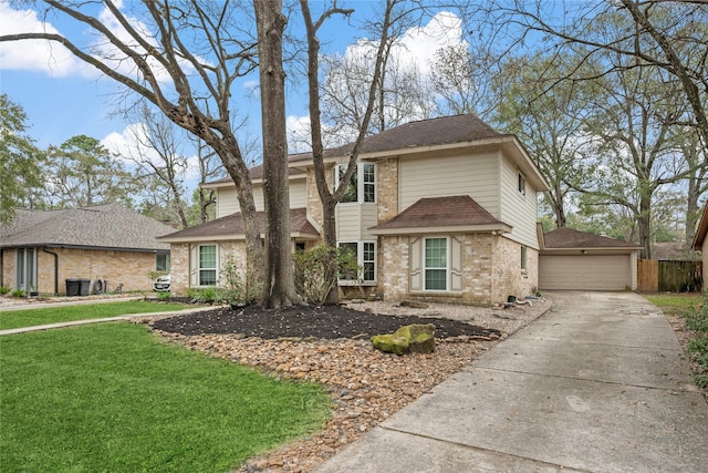 front of property featuring a garage and a front yard