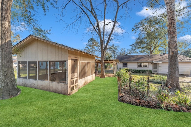 view of yard featuring a sunroom