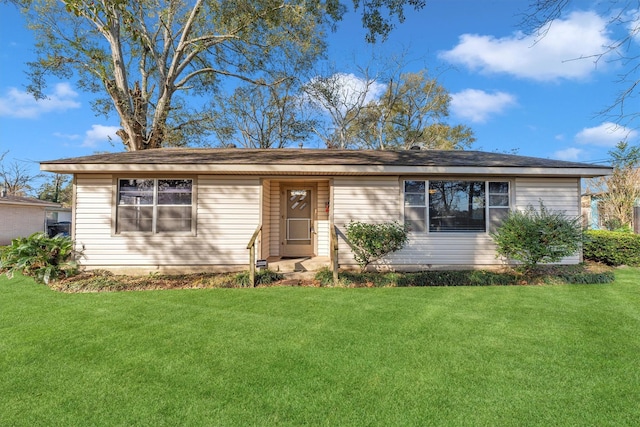 ranch-style home with a front lawn