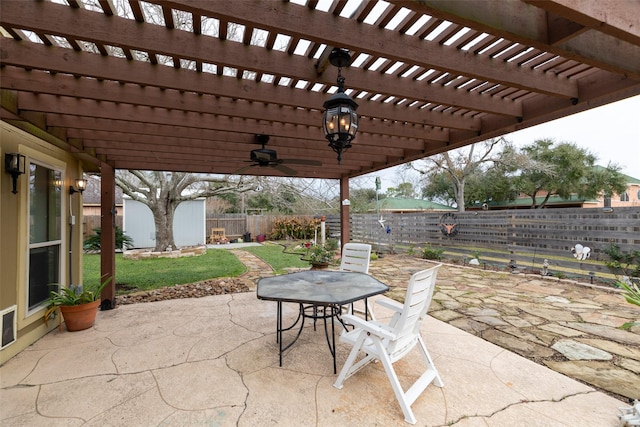 view of patio with ceiling fan and a pergola