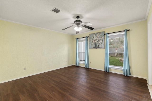 unfurnished room with ceiling fan, a textured ceiling, dark hardwood / wood-style flooring, and crown molding