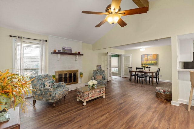 living room featuring ceiling fan, a brick fireplace, dark hardwood / wood-style flooring, and lofted ceiling