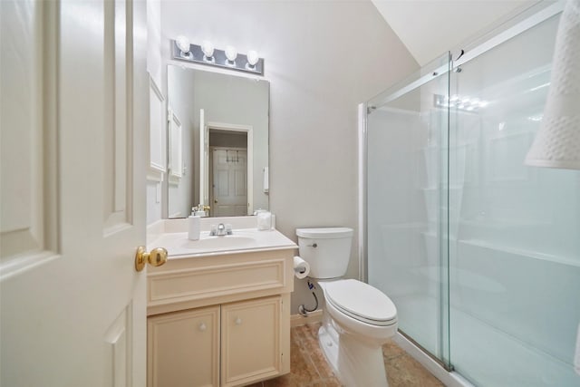 bathroom with tile patterned flooring, an enclosed shower, toilet, vanity, and lofted ceiling