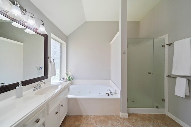 bathroom with tile patterned floors, vanity, lofted ceiling, and independent shower and bath