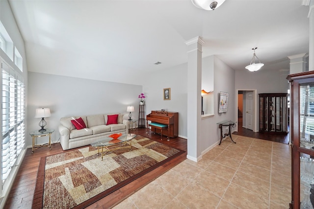 living room featuring decorative columns