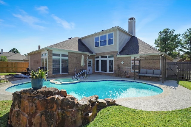 view of pool featuring an in ground hot tub, a patio area, and a gazebo