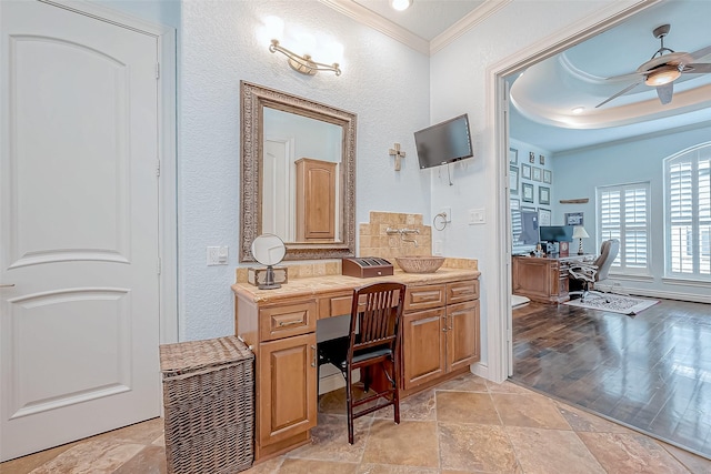 bathroom featuring vanity, ornamental molding, and ceiling fan