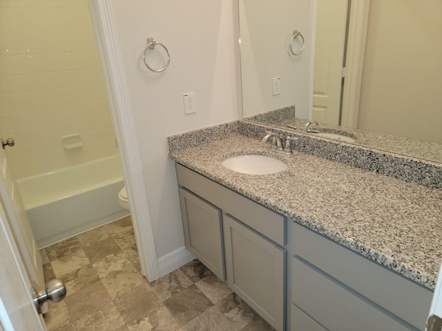 full bathroom with tub / shower combination, toilet, and vanity