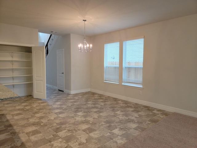 unfurnished dining area featuring an inviting chandelier