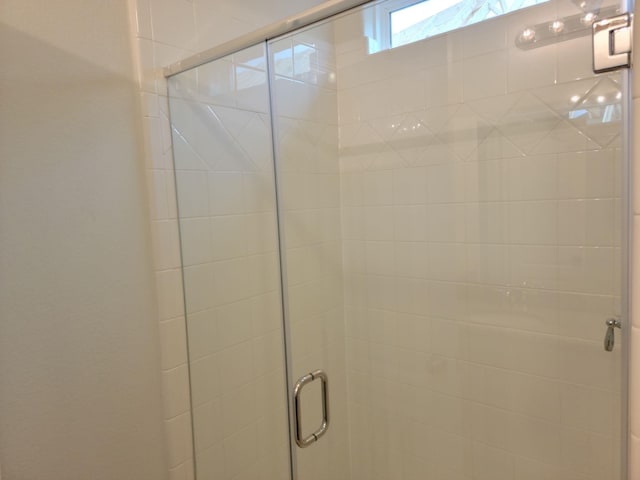 bathroom featuring an enclosed shower