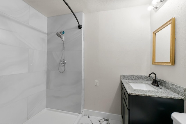 bathroom with vanity and a shower