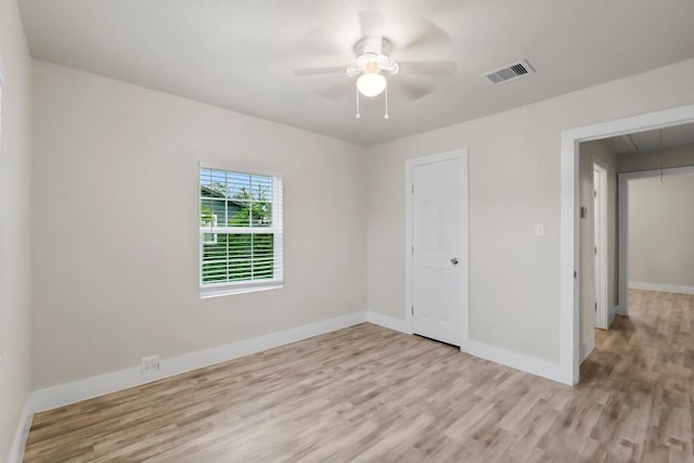 empty room featuring light hardwood / wood-style flooring and ceiling fan