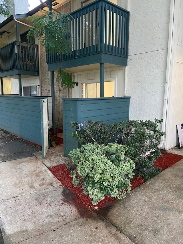 view of side of property featuring a balcony