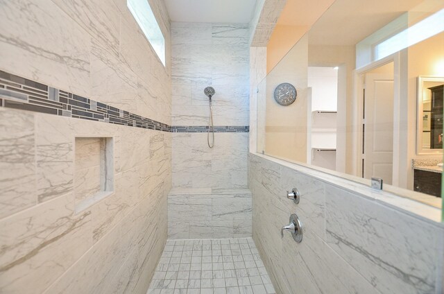 bathroom featuring a tile shower