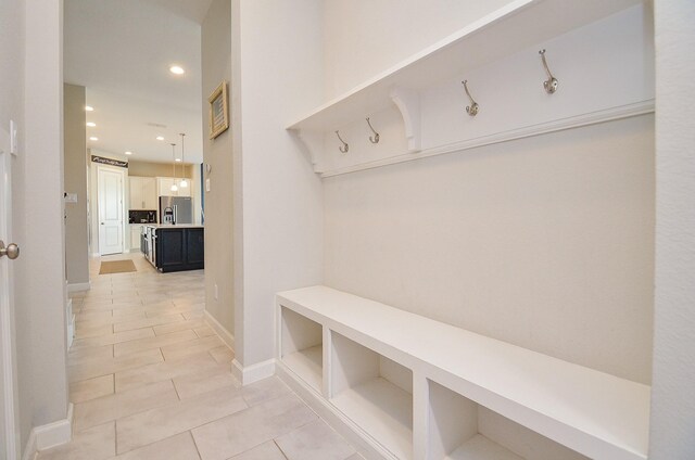 mudroom with light tile patterned floors