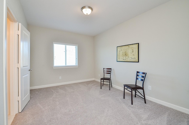 living area with light carpet