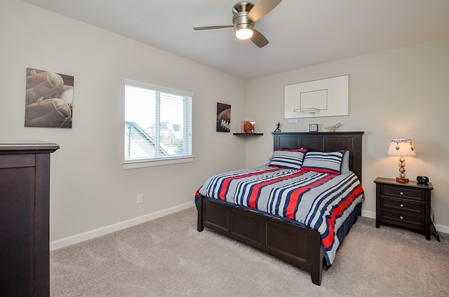 bedroom with light colored carpet and ceiling fan