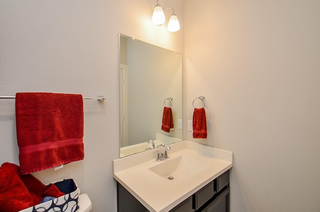 bathroom with toilet and vanity