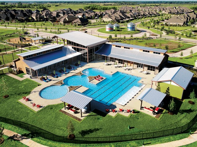 view of pool featuring an outbuilding