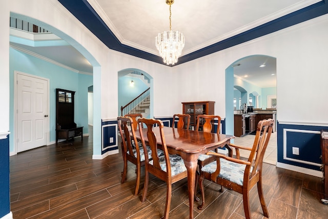 dining room featuring a chandelier and ornamental molding