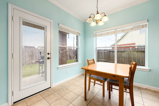 dining area featuring crown molding, a chandelier, and light tile patterned flooring