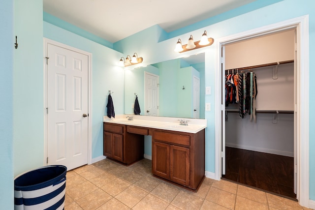 bathroom with tile patterned flooring and vanity