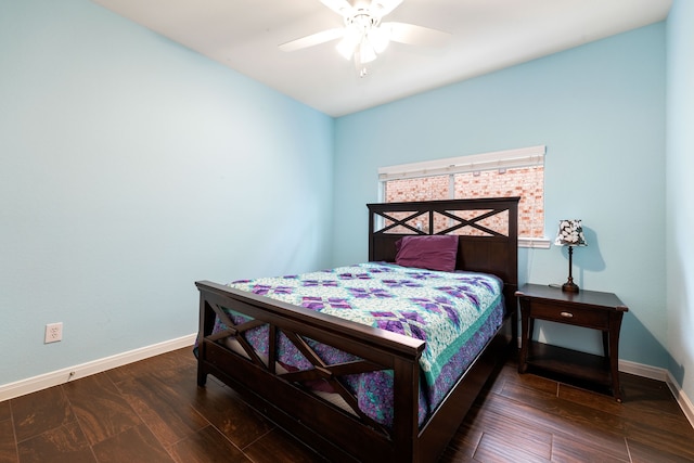 bedroom with ceiling fan and dark hardwood / wood-style flooring