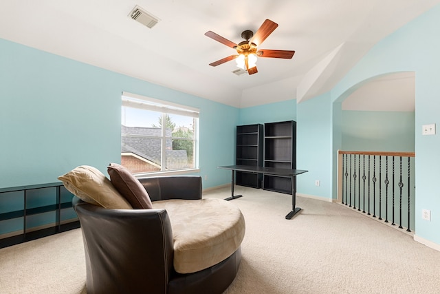 living area featuring ceiling fan, lofted ceiling, and carpet flooring