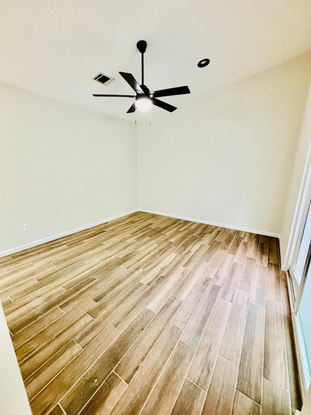 empty room featuring light hardwood / wood-style floors and ceiling fan