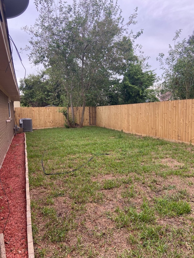 view of yard featuring central AC unit