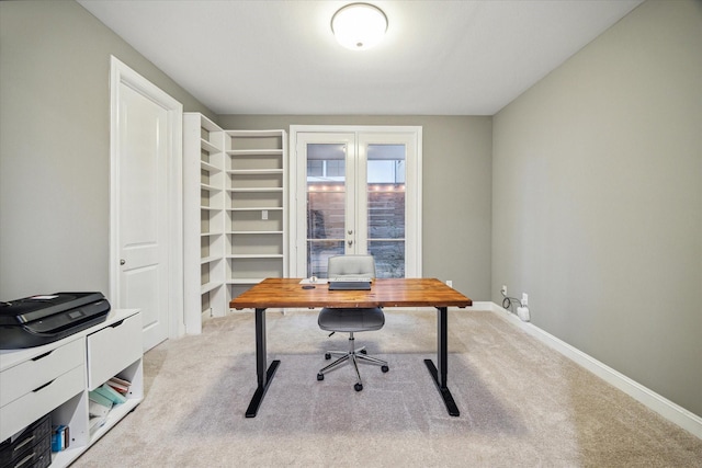 carpeted office featuring french doors