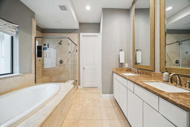 bathroom featuring vanity, tile patterned floors, and separate shower and tub