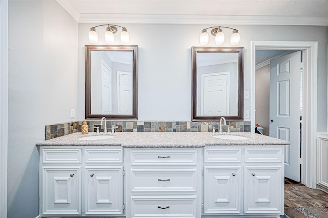 bathroom with vanity and ornamental molding