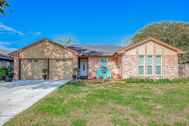 ranch-style home featuring a garage and a front lawn