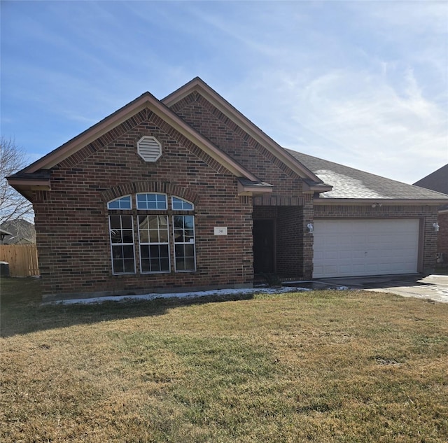 view of front of home featuring a garage and a front yard