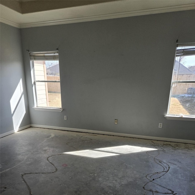 unfurnished room featuring concrete floors and ornamental molding