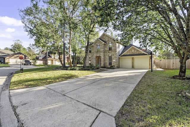 view of front of home featuring a garage and a front lawn