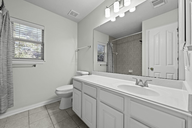 bathroom with vanity, toilet, a shower with shower curtain, and tile patterned flooring