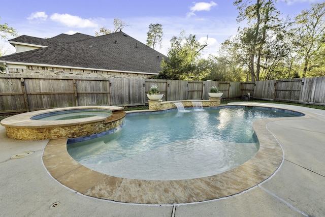 view of swimming pool with an in ground hot tub and pool water feature