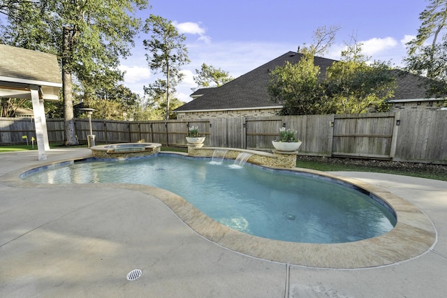 view of swimming pool featuring an in ground hot tub, a patio area, and pool water feature