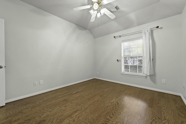 spare room featuring ceiling fan, dark hardwood / wood-style floors, and lofted ceiling