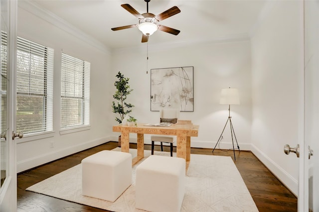 office area with dark hardwood / wood-style flooring, ornamental molding, and a healthy amount of sunlight