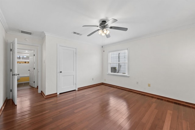 unfurnished bedroom with ceiling fan, ornamental molding, and dark wood-type flooring