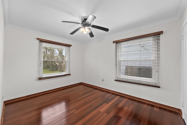 spare room with crown molding, wood-type flooring, and ceiling fan