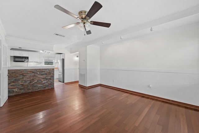 unfurnished living room with crown molding, ceiling fan, and dark hardwood / wood-style flooring