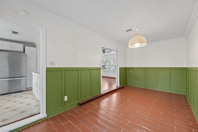 unfurnished room featuring ceiling fan, wooden ceiling, and crown molding