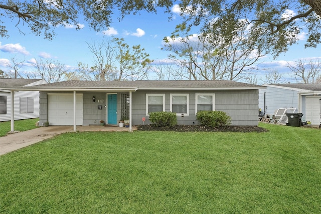 ranch-style home with a garage and a front lawn